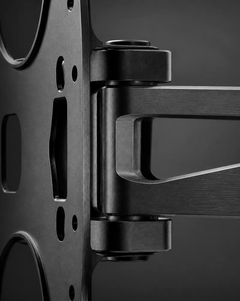 Close-up of laser-cut steel bracket edges and a pivot joint